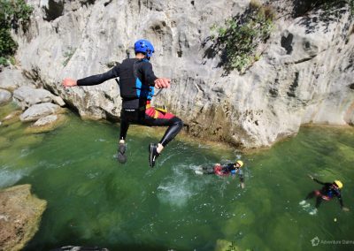 Cliff jumping on a canyoning tour; Cetina river